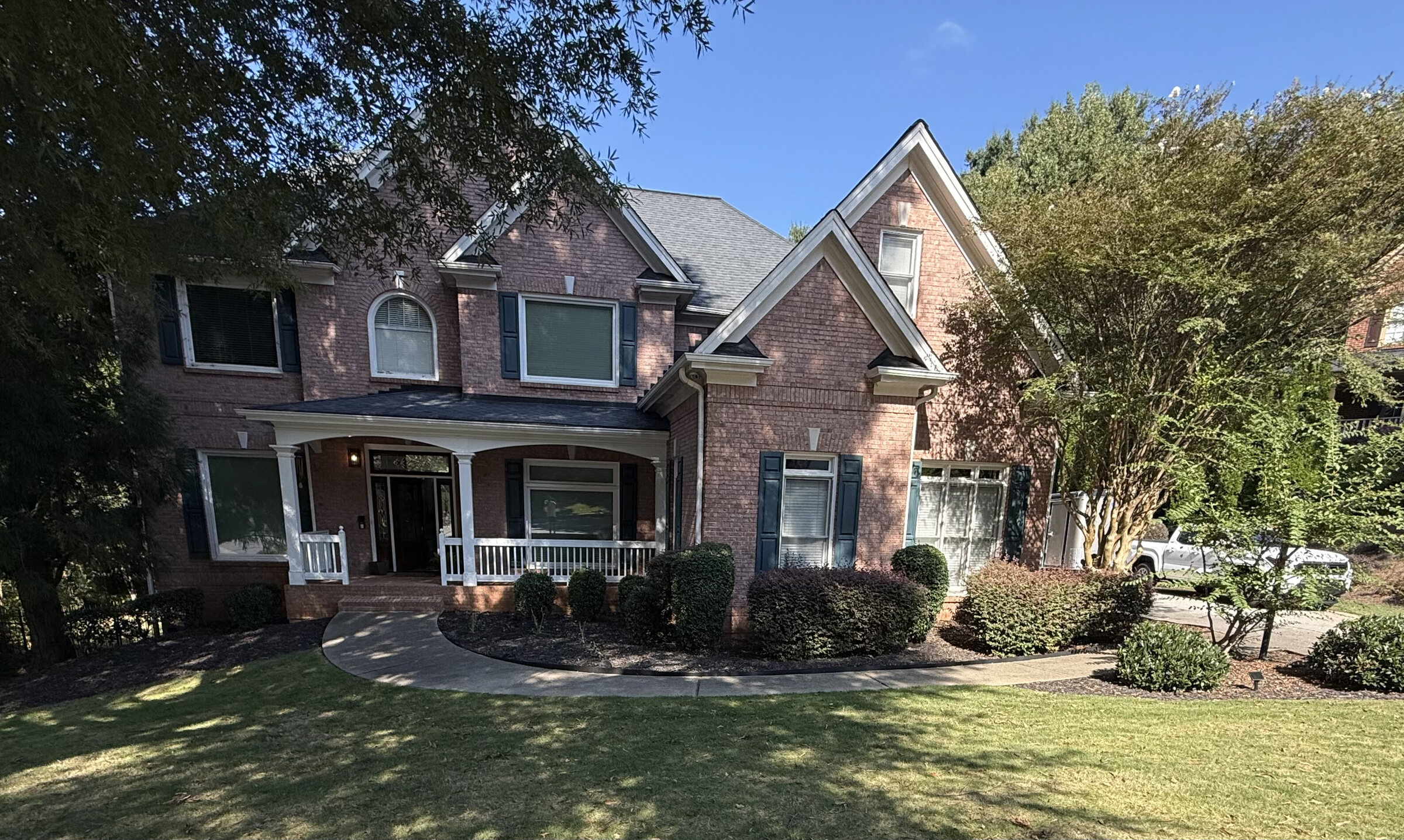 Front exterior of 915 Gunter Ct, a brick home with a white columned porch